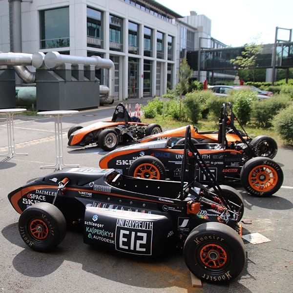 a group of elefant racing cars